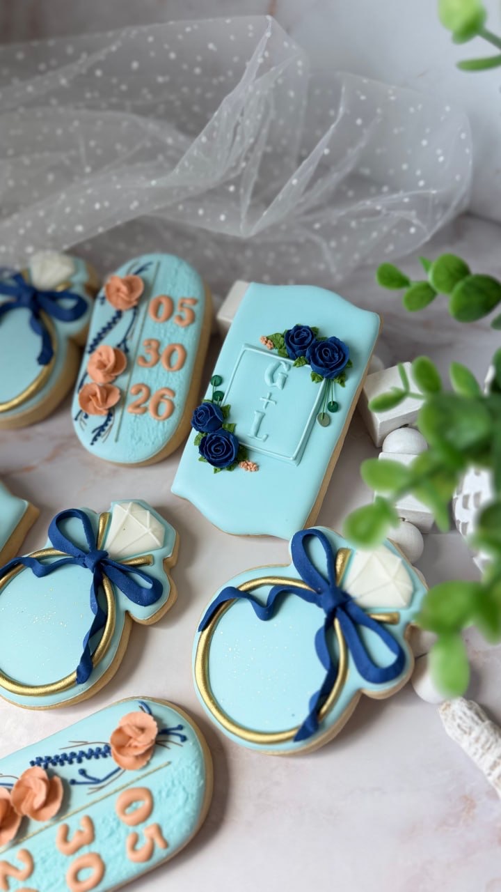 Aqua, navy and gold wedding cookies with floral details